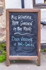 Lindisfarne, Holy Island, Berwick-upon-Tweed, Northumberland, England. Chalkboard sign outside pub. Art Print